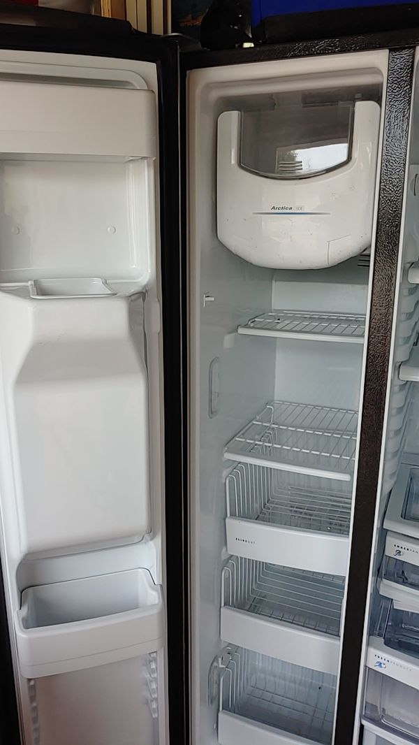 GE sidebyside refrigerator stainless steel front black on sides for