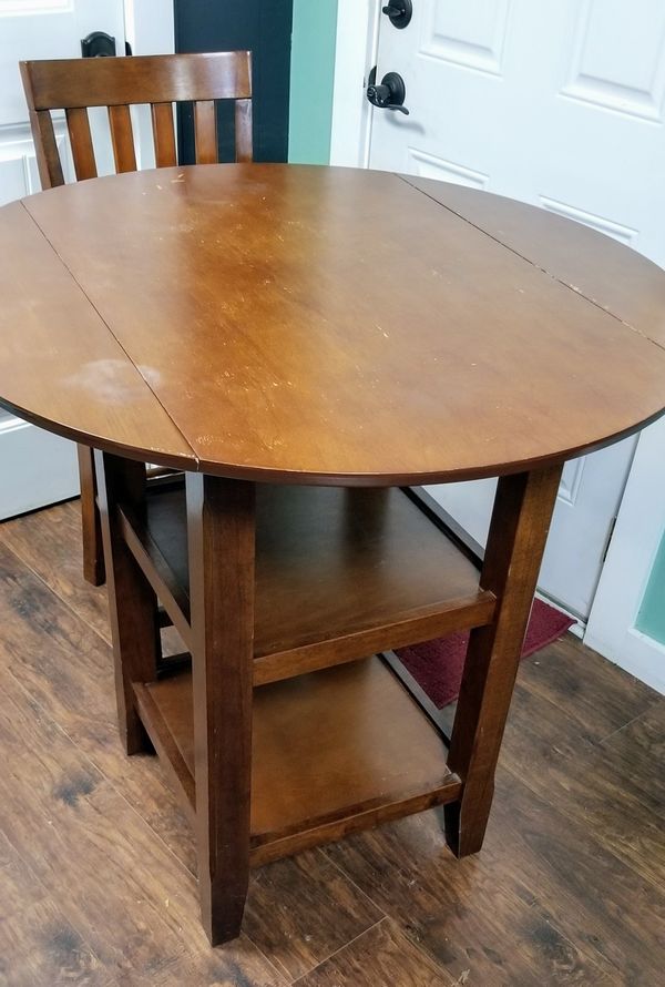 4 person Table with drop down sides, storage, and 2 chairs for Sale in
