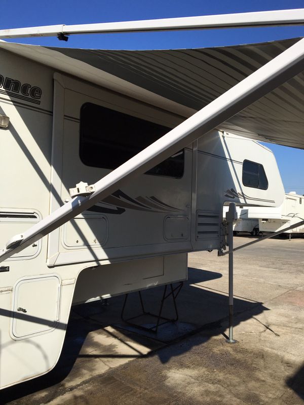 Lance model 1120 cab over camper ,2003 .loaded remote electric jacks,3.