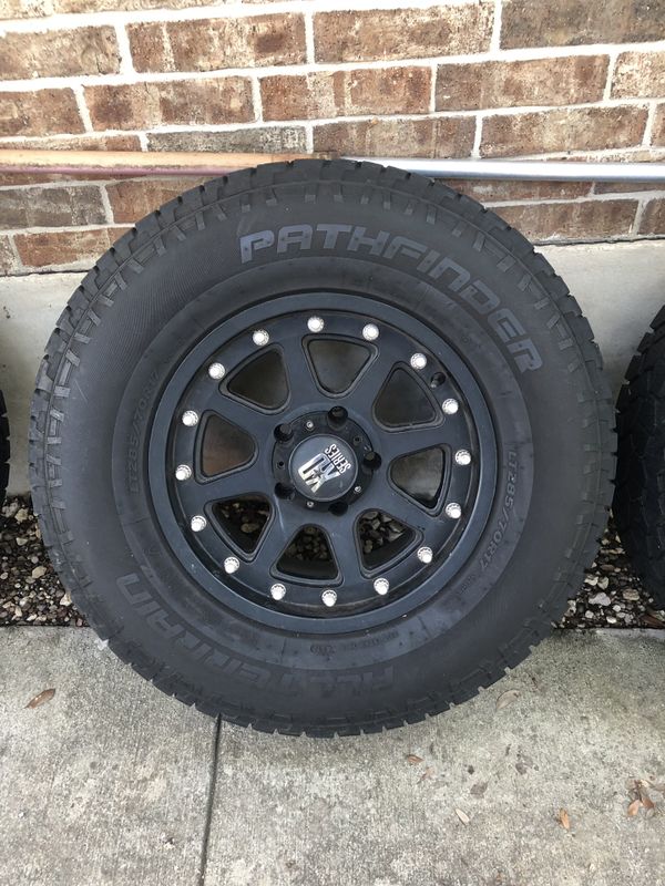 4 All Terrain (AT) pathfinder tires (285/70/17) with 17in XD series