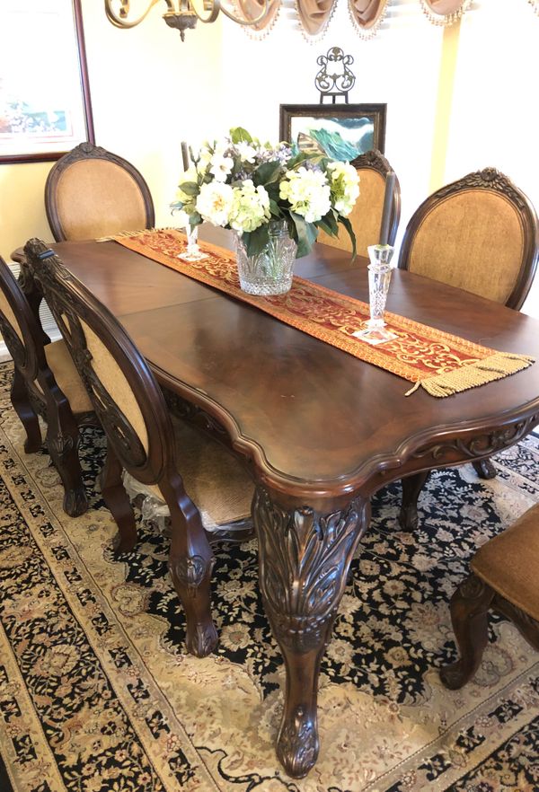 High end hand carved dining room table and chairs. for Sale in