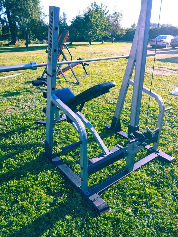 Nautilus! Combination squat rack/ weight bench with Lat Bar pulley and Olympic barbell for
