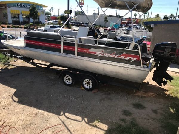 1990 spectrum 24 foot pontoon with 120 hp merc cruiser for