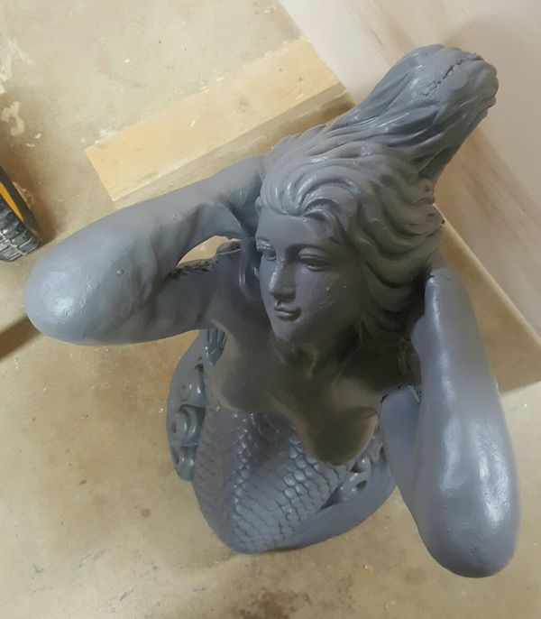 large concrete mermaid statue