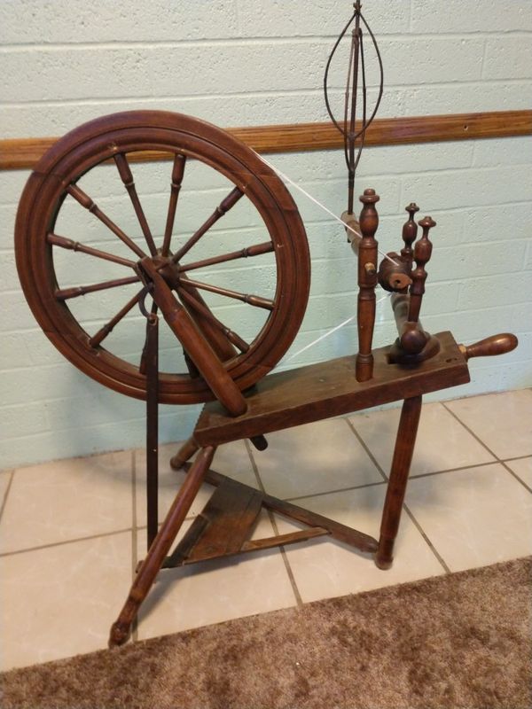 1800's spinning wheel. It spins with the treddle, but would need some ...