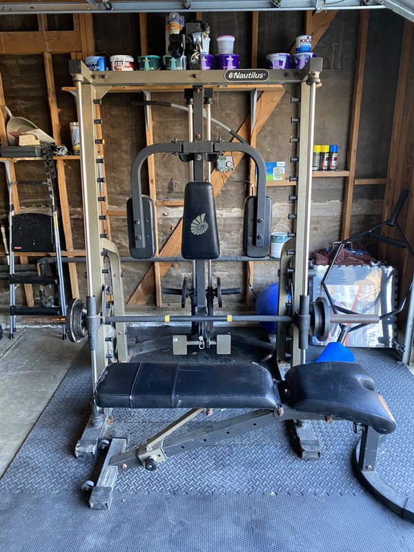 Nautilus smith machine. Squat rack. Pulley system. Bench and
