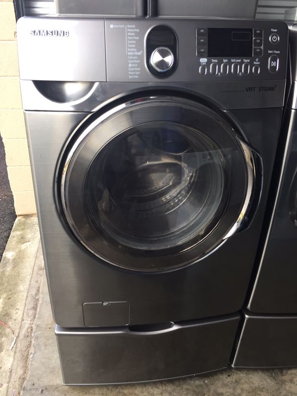 Samsung frontload extra large capacity steam option washer and gas dryer set on pedestals
