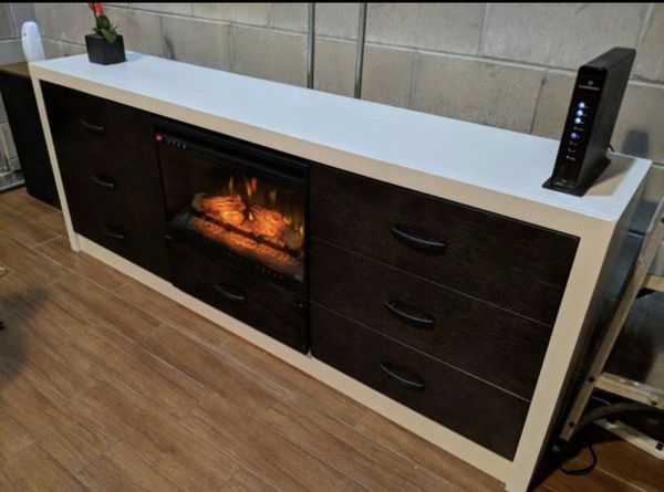 Selling entertainment stand has fireplace heater included for Sale in
