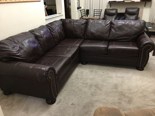 2pc Brown Leather Nailhead Trim Sectional Banner By Ashley