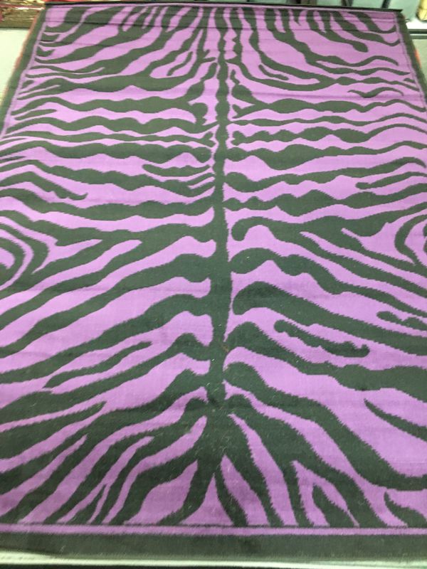 purple and black zebra rug