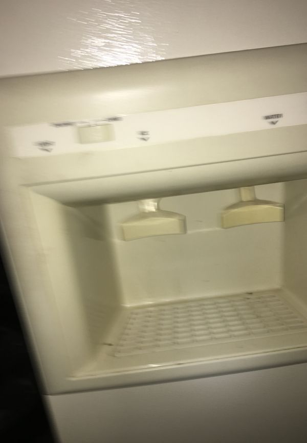 Kenmore refrigerator with ice machine cubes and crushed ice. Water