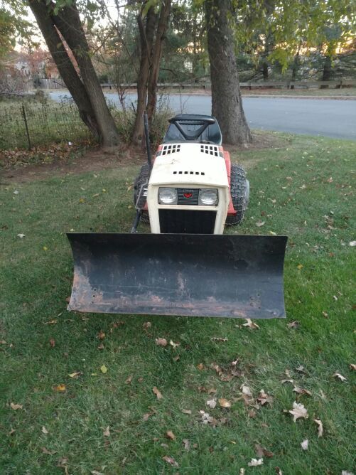Simplicity 6216 garden tractor with plow wheel weights chains and mower
