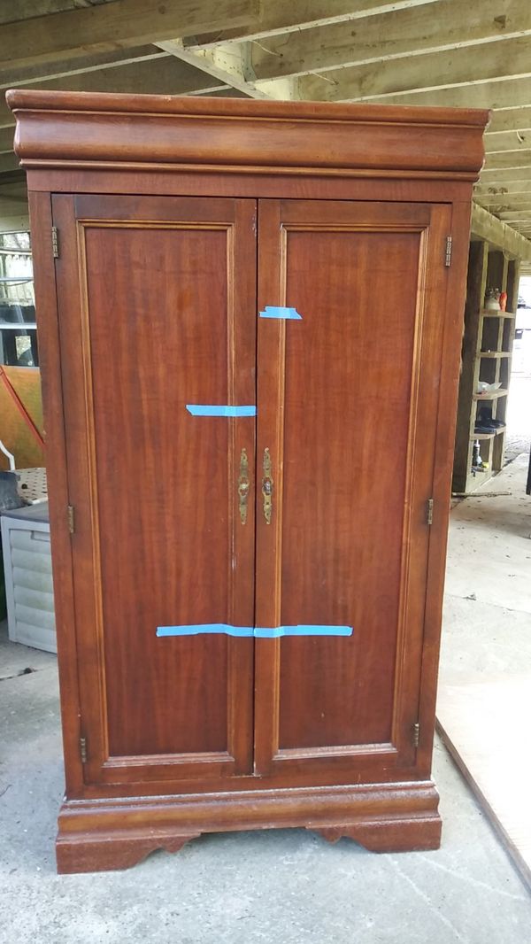 solid wood armoire about 7 ft tall about 5 foot long about 4 ft wide
