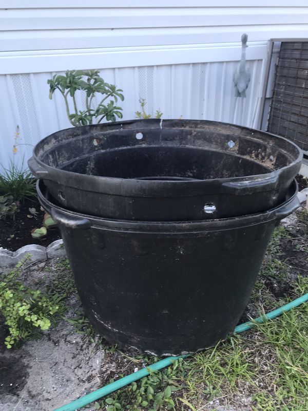 2 GIGANTIC. 50 gallon plastic plant pots for Sale in Hobe Sound, FL