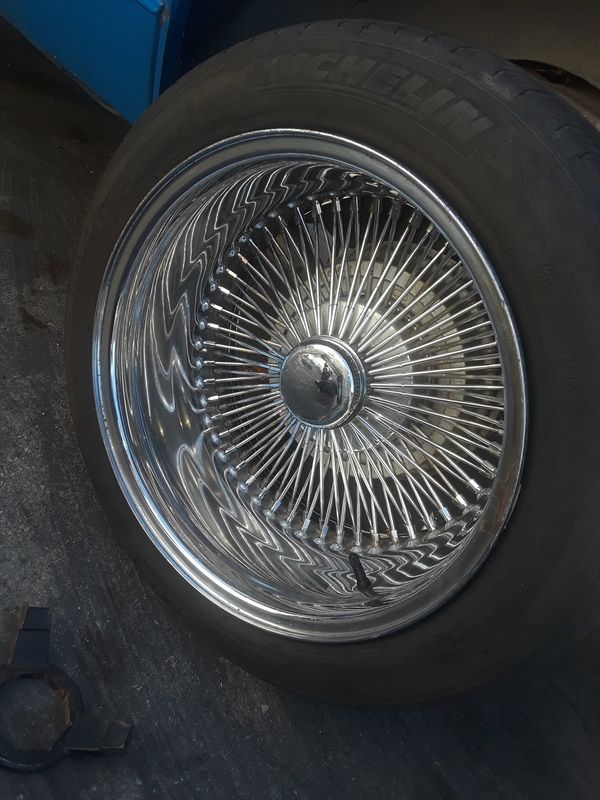 FOUR. 17 INCH 100 SPOKE WIRE WHEELS.With knock offs &adptrs for Sale in ...