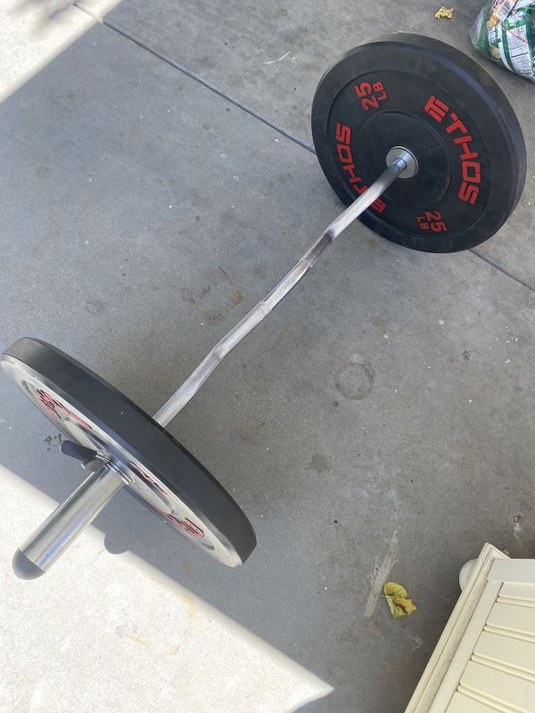 Ethos 25 pounds bumper plates with olympic curl bar for Sale in Los