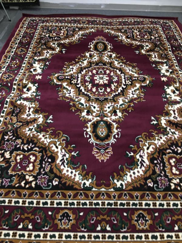 Burgundy color area rug brand new thin quality for Sale in Salem, OR