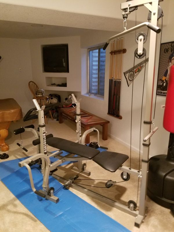 Weight Bench with pulley system for leg lifts, tricept curls, etc. and
