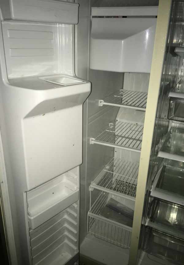 Kenmore refrigerator with ice machine cubes and crushed ice. Water