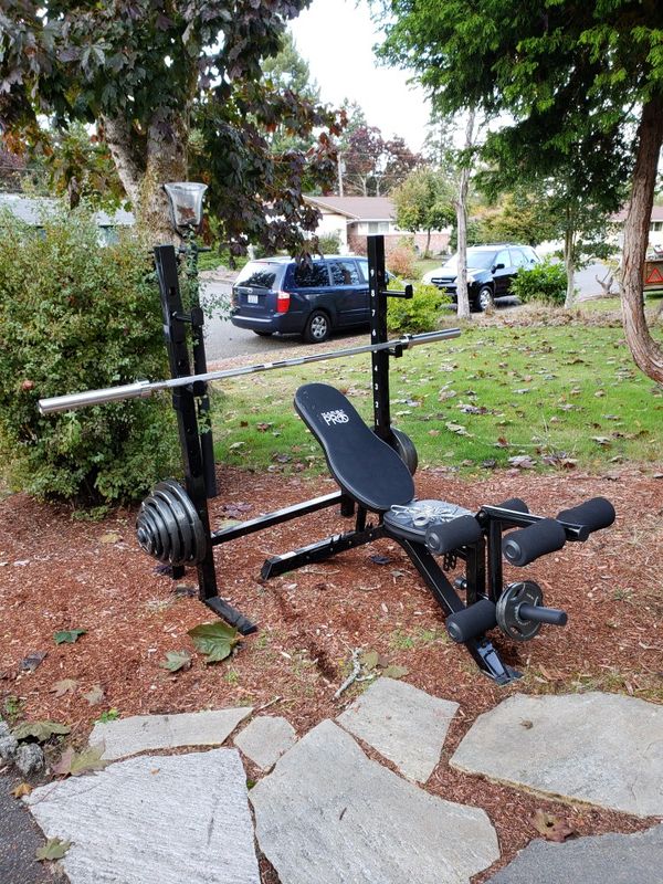 Marcy Pro adjustable weight Bench with squat stand and 300lb Olympic