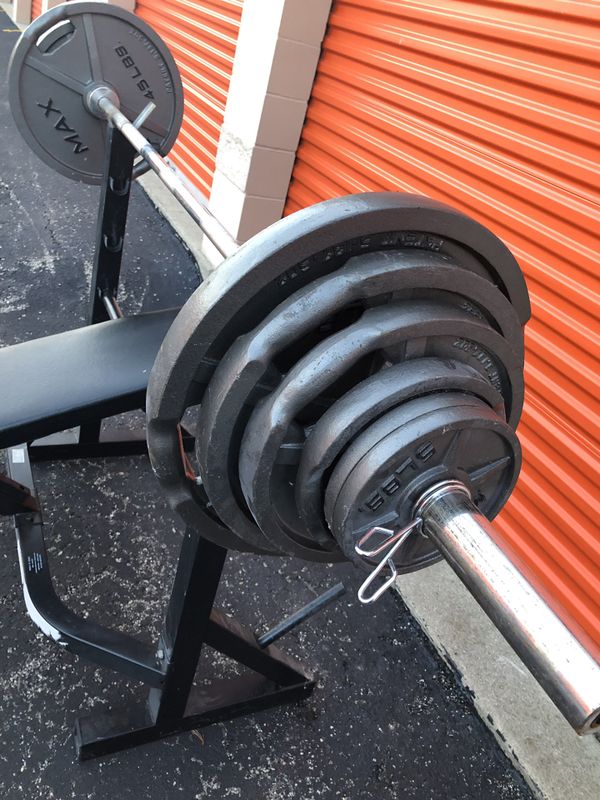 Bench, 250 lbs of Olympic weights, 45 lb Olympic bar for Sale in