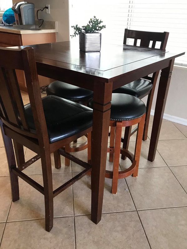 Small high top kitchen table. 2 chairs and 2 stools. Has some puppy