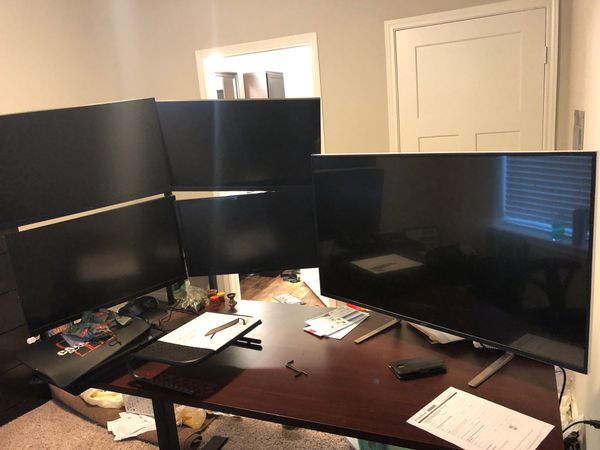 4 monitors with stand 200 . one 43 inch monitor like new