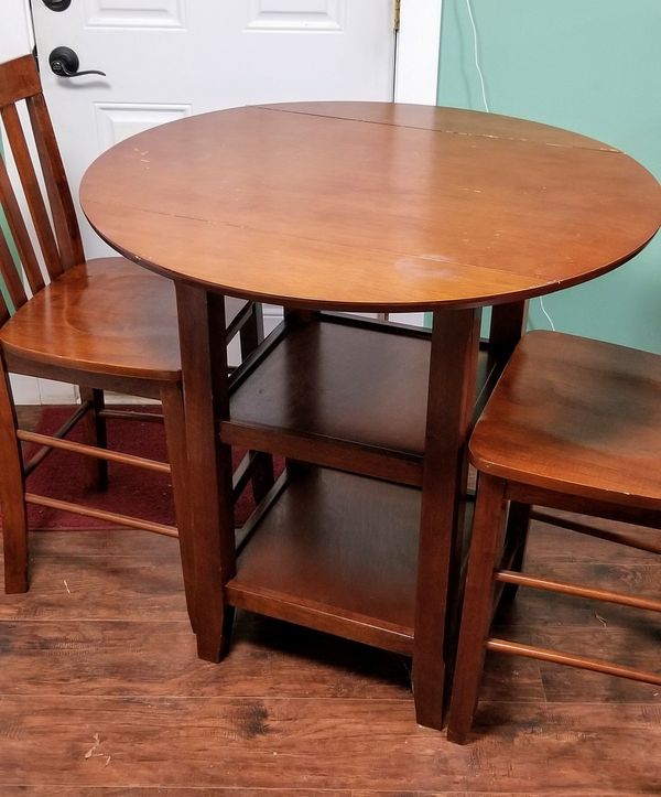 4 person Table with drop down sides, storage, and 2 chairs for Sale in