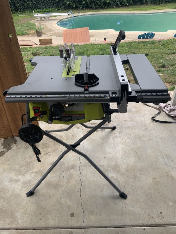 Ryobi 10 inch table saw with rolling fold up stand Powerful 15 amp motor and extra wide table