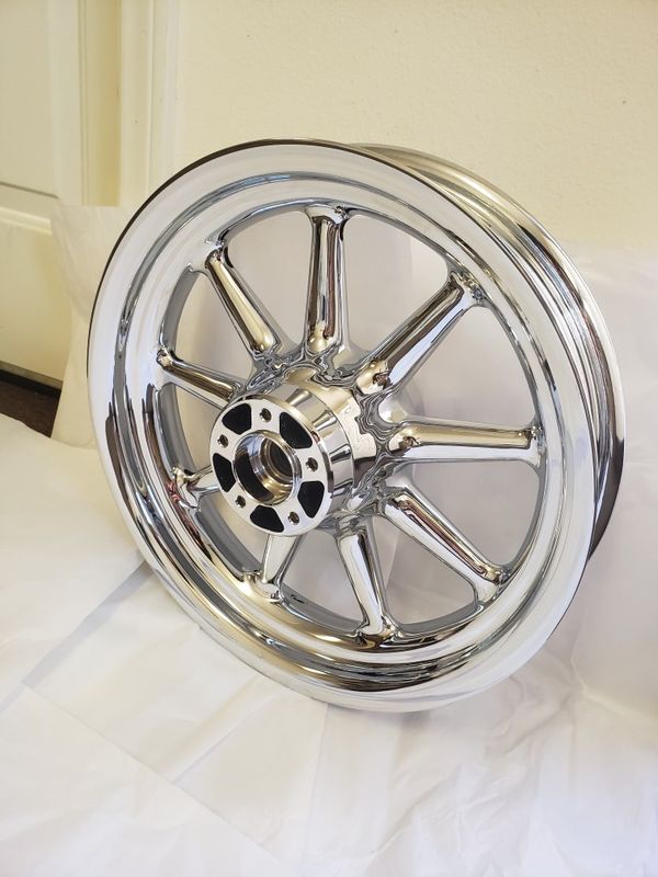 Harley Davidson front 9 spoke wagon wheel.. Triple chrome plated finish