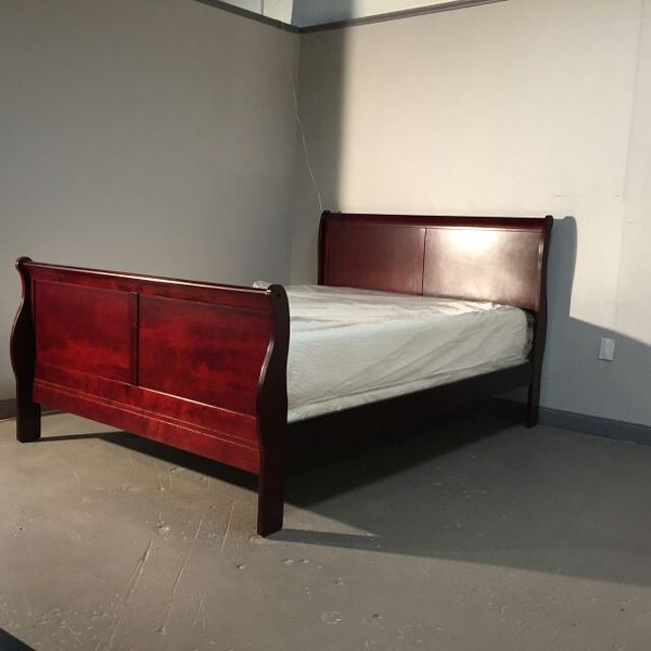 Brand new queen size sleigh bed with inner spring plush mattress and