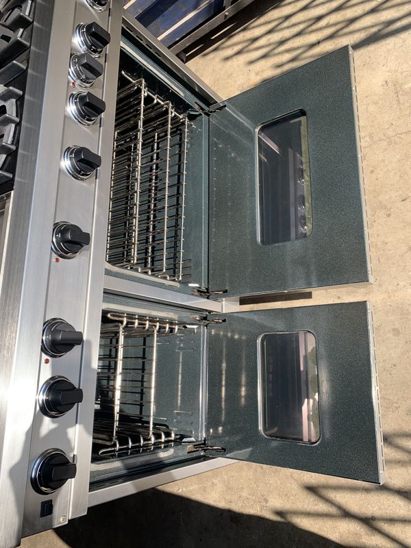 48 inch Viking brand range, island vent and trim, 2 ovens, 6 burners and griddle. Epic stove for